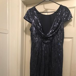 A mid-length blue sequin dress